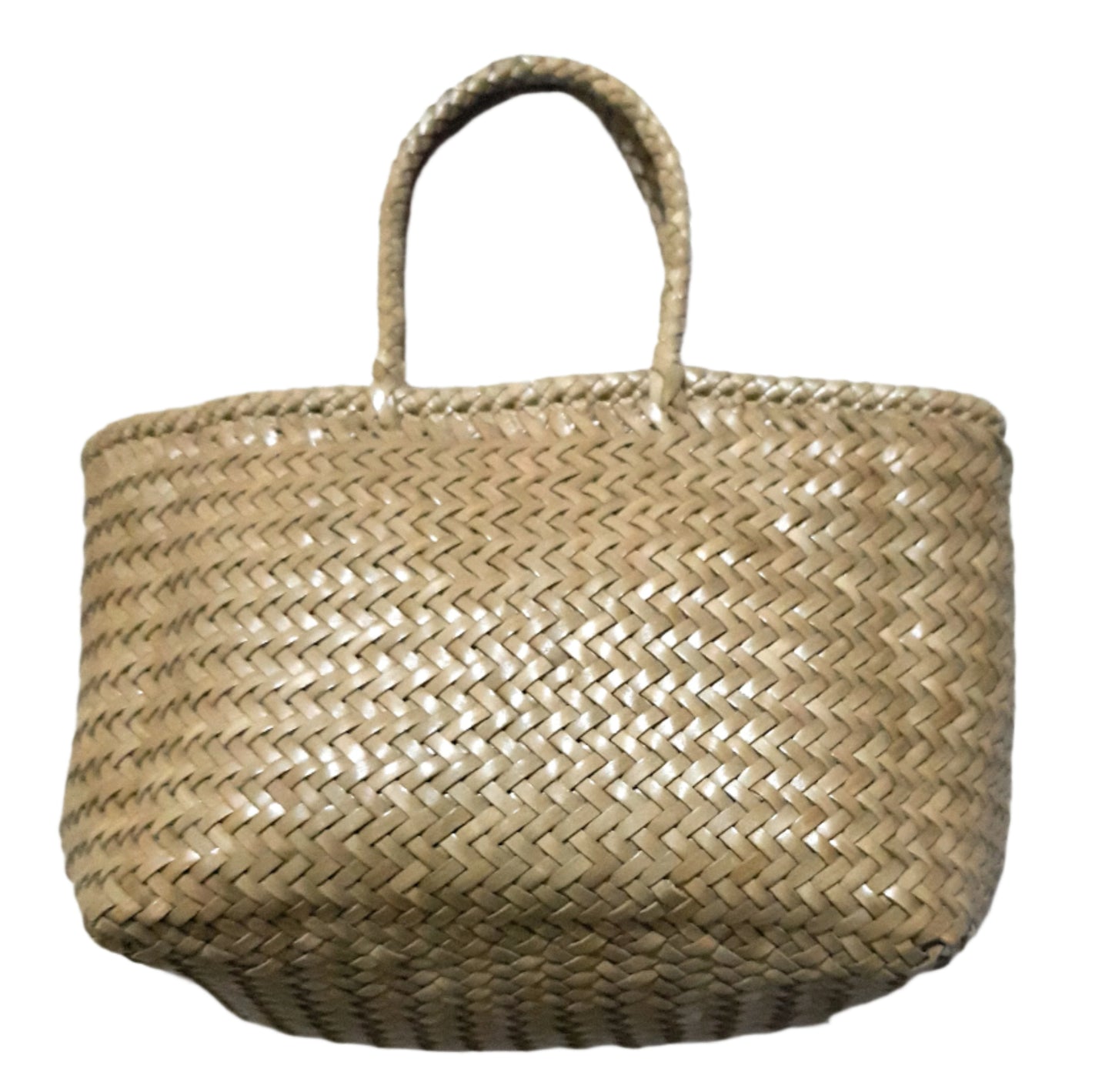 Woven leather bag on a textured white background