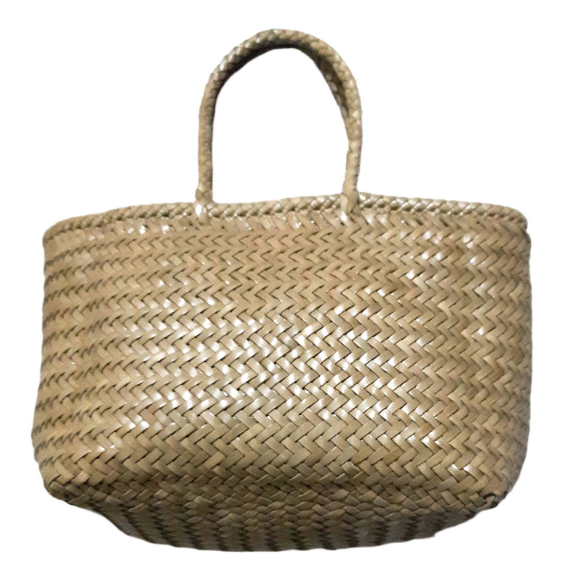 Woven leather bag on a textured white background